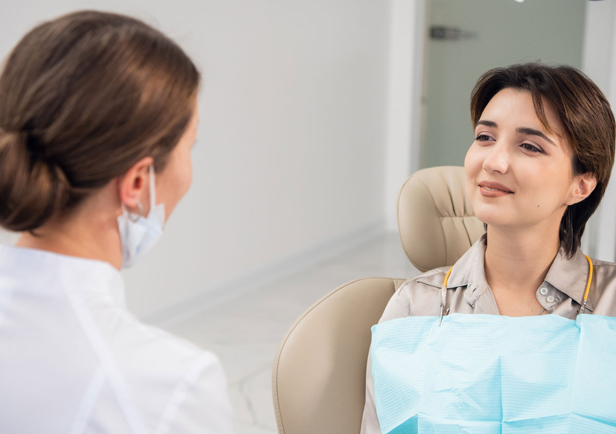 A dentist talking with a patient