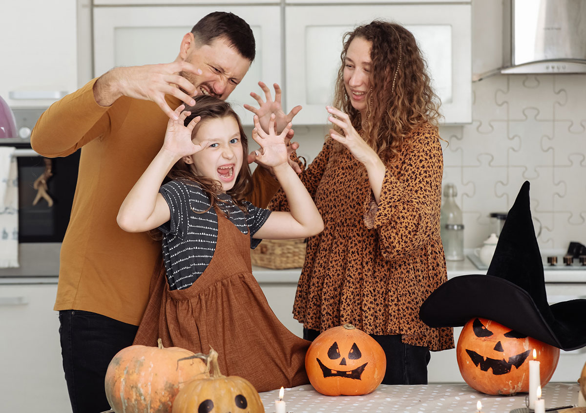 Happy family celebration of halloween at home