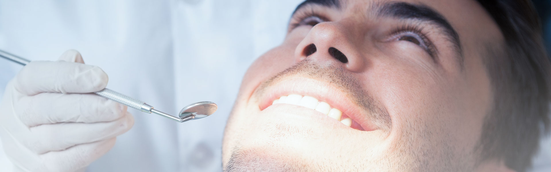 A man is smiling at dental